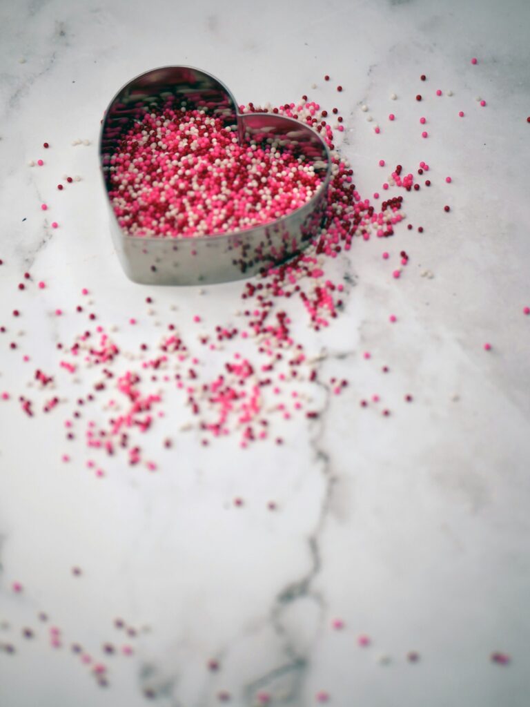 sprinkles in a heart shaped cookie cutter