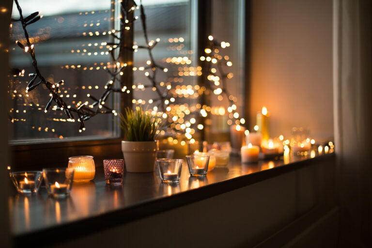 Cozy winter string lights and candles