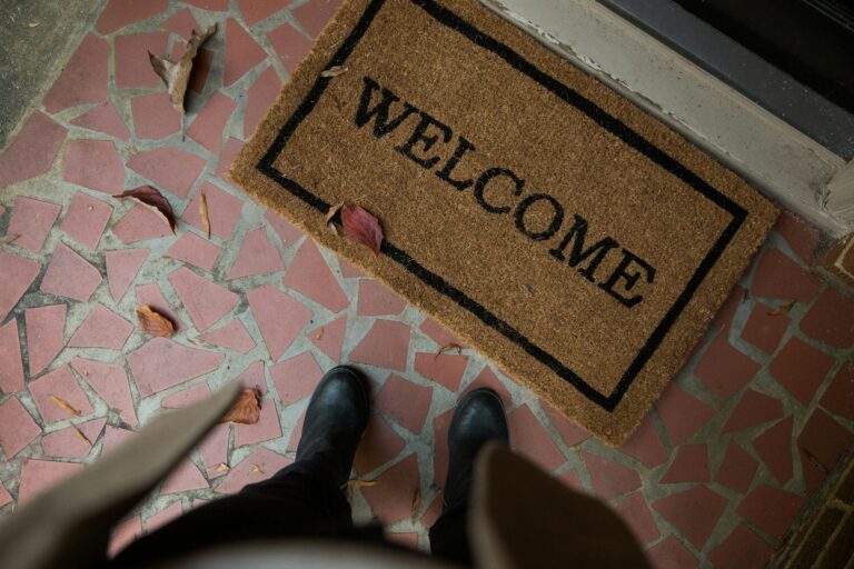 welcome mat and a front door