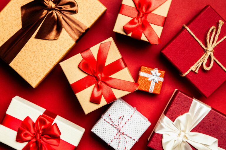 presents wrapped in gold, red, and silver paper